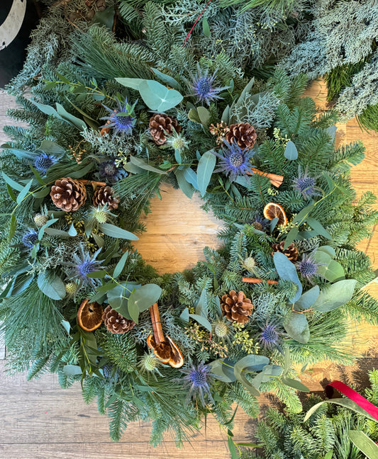 Side view of eucalyptus and pine Christmas wreath with rich texture and natural fragrance.