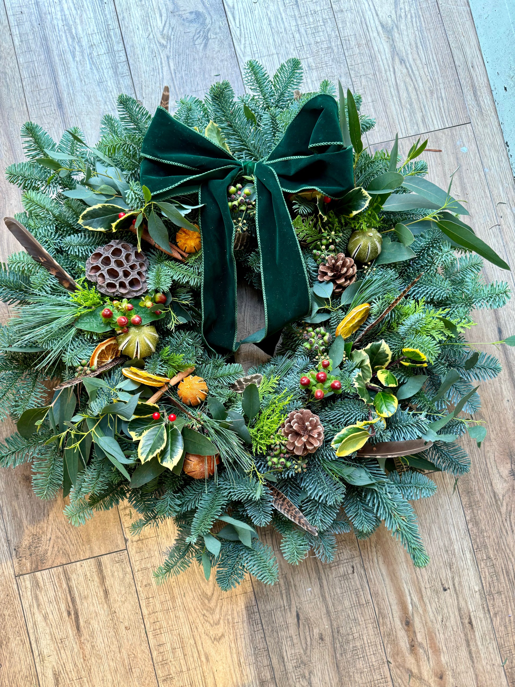 Side view of pampas and winter berry wreath with rich texture – Barns Florals Cornwall